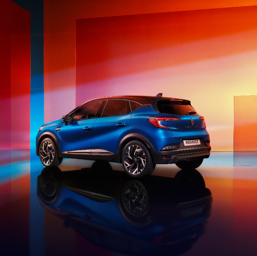 A blue car parked in a room
Description automatically generated