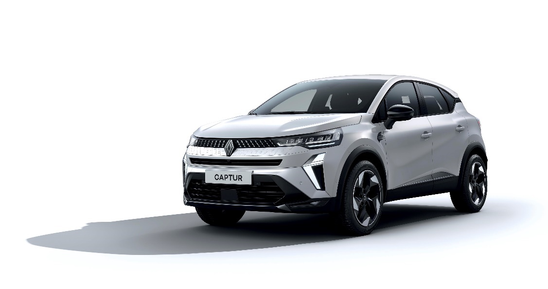A white car with black trim
Description automatically generated